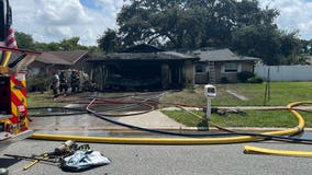 Firefighter hospitalized after crews battle fire at Dunedin home