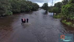 WATCH: Manatee County commissioners save woman swept away in car by floodwaters