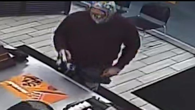 Video: Armed robbery suspect caught on camera threatening Tampa Little Caesars Pizza employees with gun