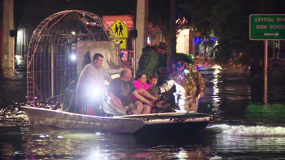 A family gets rescued after water flooded their home during a storm surge from Hurricane Helene.