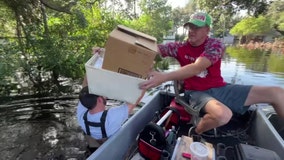 Ridge Manor residents salvage what they can from homes surrounded by floodwaters