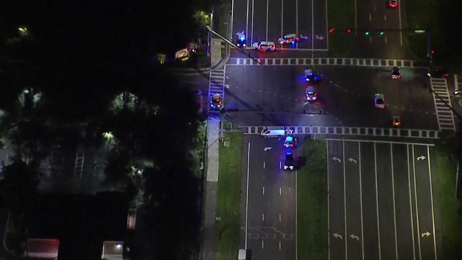 Troopers say a man died early Friday after being hit by a van at an intersection in Wesley Chapel.