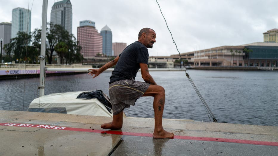 TAMPA, FLORIDA - OCTOBER 09: Tampa police try to persuade a local resident who is living on his boat known as Jay and nicknamed 