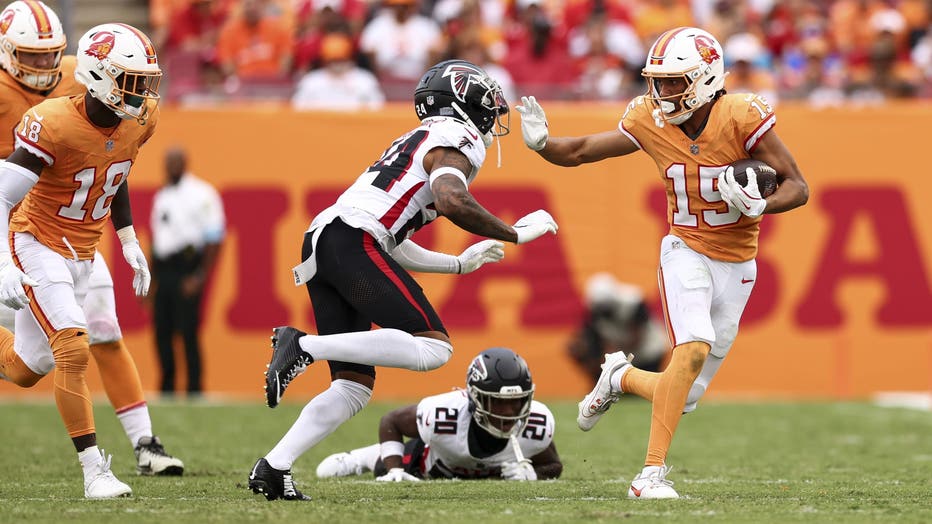 TAMPA, FLORIDA - OCTOBER 27: Jalen McMillan #15 of the Tampa Bay Buccaneers stiff arms A.J. Terrell #24 of the Atlanta Falcons during the second half of an NFL football game at Raymond James Stadium on October 27, 2024 in Tampa, Florida. (Photo by Kevin Sabitus/Getty Images)