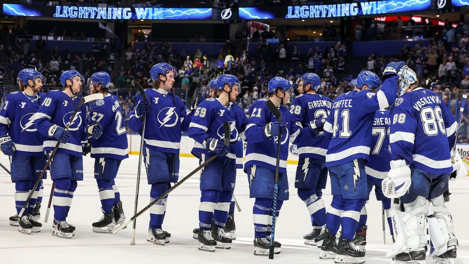 TAMPA, FL - OCTOBER 15: The Tampa Bay Lightning celebrate a win against the Vancouver Canucks at the Amalie Arena on October 15, 2024 in Tampa, Florida. (Photo by Mike Carlson/Getty Images)