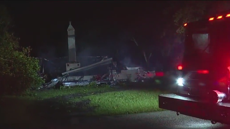 Neighbors say they woke up to a large fire that destroyed a home in Tampa's Riverside Heights neighborhood early Thursday.