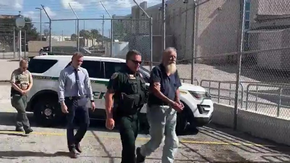 John Burgos being walked into the Brevard County Jail. Image is courtesy of the Brevard County Sheriff's Office.