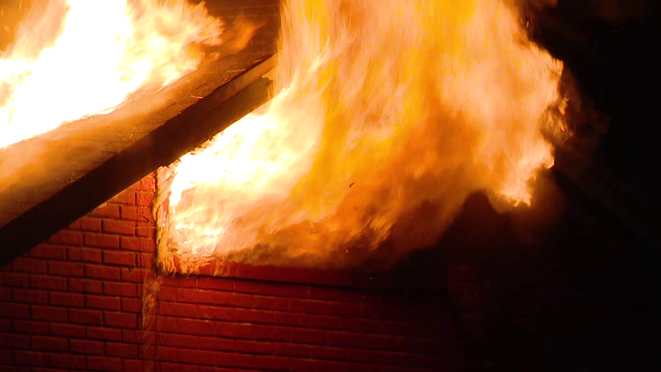 Crews battled a large fire early Wednesday at a two-story home off East Emily Street in Tampa.