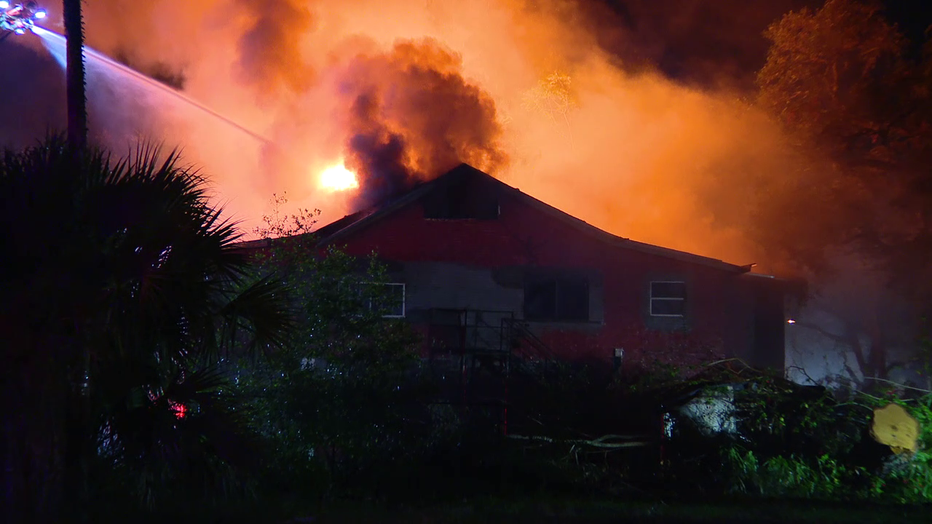Crews battled a large fire early Wednesday at a two-story home off East Emily Street in Tampa.