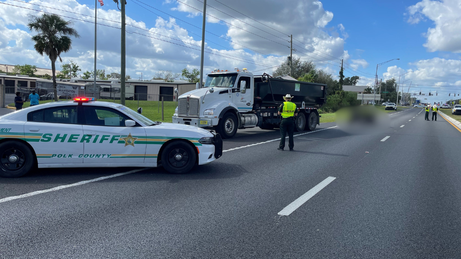 A man died after trying to climb onto a City of Lakeland dump truck, then falling and getting run over, the Polk County Sheriff's Office said. (Photo courtesy of the Polk County Sheriff's Office.)
