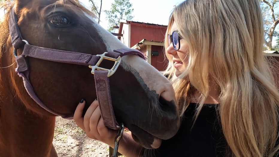 Averie Kimelton with the horse she saved during Hurricane Milton.