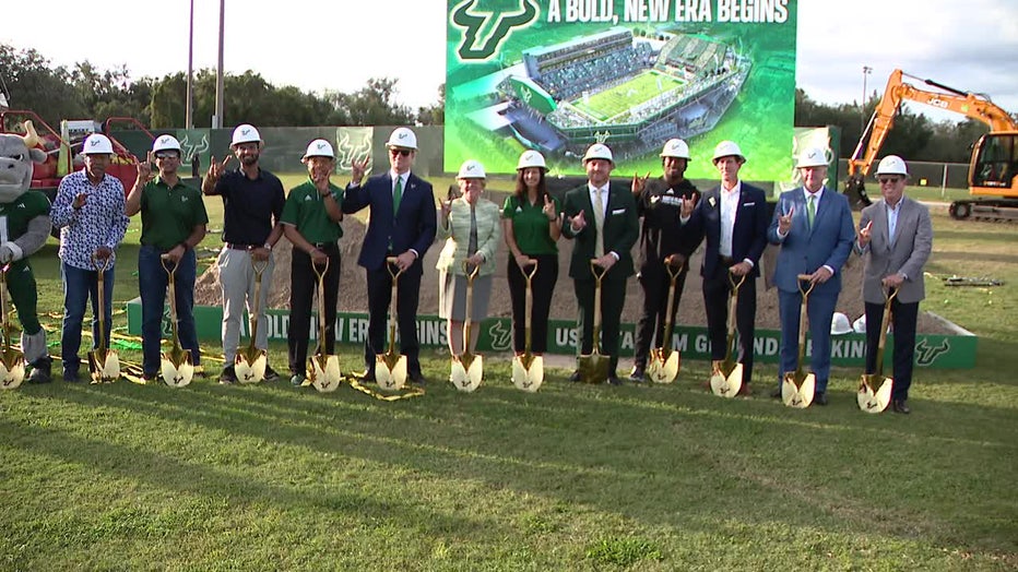 USF officials, with local politicians, team players, and other people affiliated with the stadiums development breaking ground on the stadium.