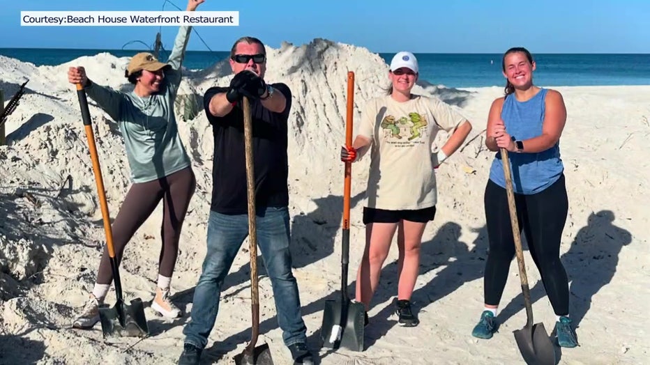 One of the teams cleaning hurricane damage from Beach House restaurant.