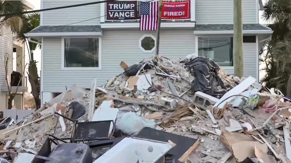 File: Trump/Vance sign hangs up hurricane damage.