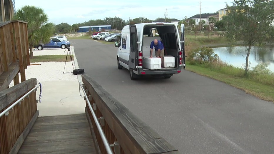 Workers unload dozens of coral species at the Coral Conservation and Research Center in Apollo Beach after Hurricanes Helene and Milton.