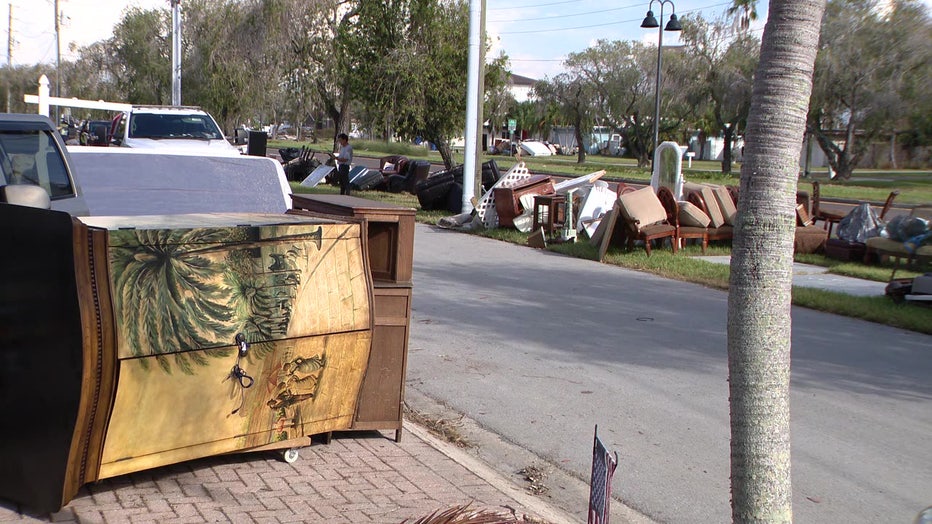 Storm debris on the sidewalks of a Tampa street.