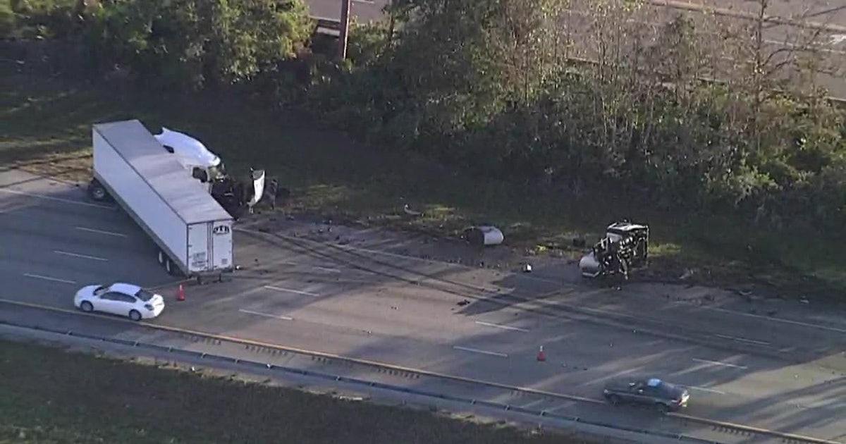 Crash involving semi-truck causes cooking oil spill, blocks
