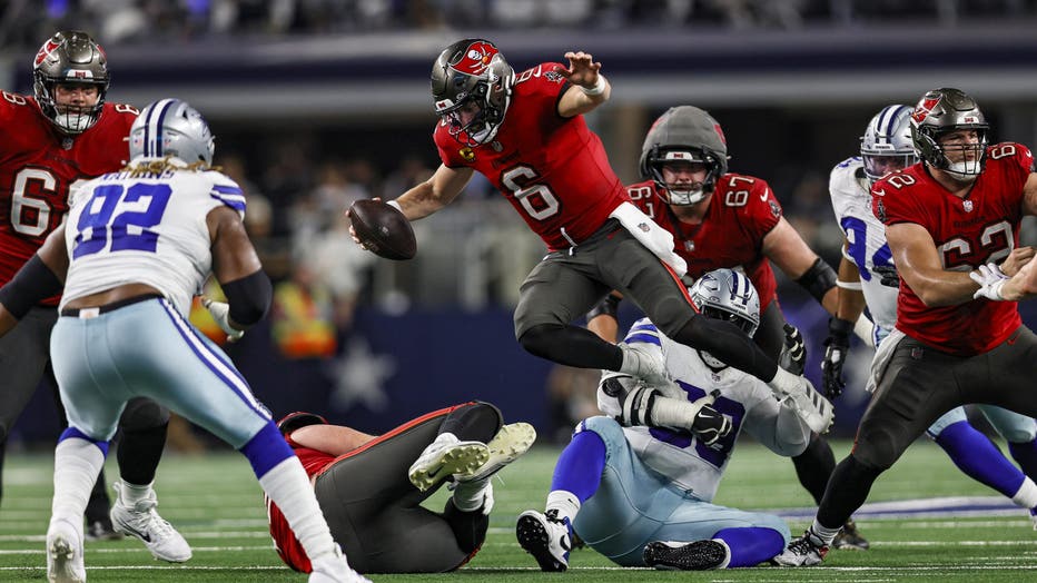 ARLINGTON, TX - DECEMBER 22: Tampa Bay Buccaneers quarterback Baker Mayfield (6) gets sacked by Dallas Cowboys defensive tackle Linval Joseph (93) during the game between the Dallas Cowboys and the Tampa Bay Buccaneers on December 22, 2024 at AT&T Stadium in Arlington, Texas. (Photo by Matthew Pearce/Icon Sportswire via Getty Images)