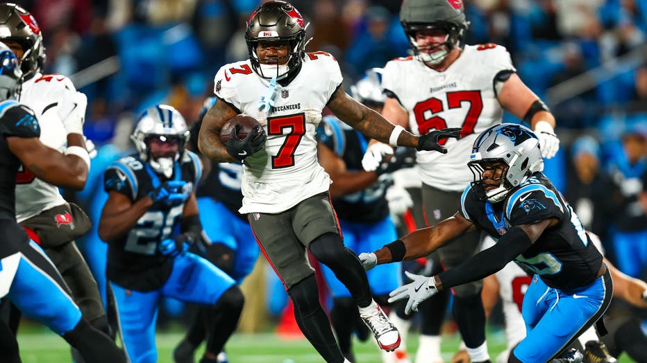 CHARLOTTE, NC - DECEMBER 01: Bucky Irving #7 of the Tampa Bay Buccaneers runs the ball during the second half of a football game against the Carolina Panthers at Bank of America Stadium on December 1, 2024 in Charlotte, North Carolina. (Photo by David Jensen/Icon Sportswire via Getty Images)