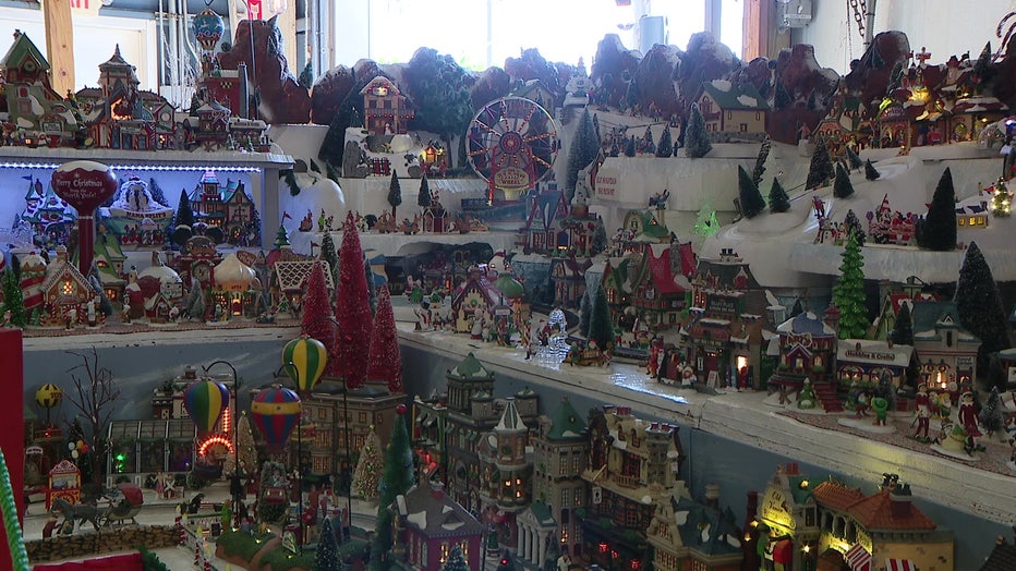 The Christmas Village features multiple layers and six trains.