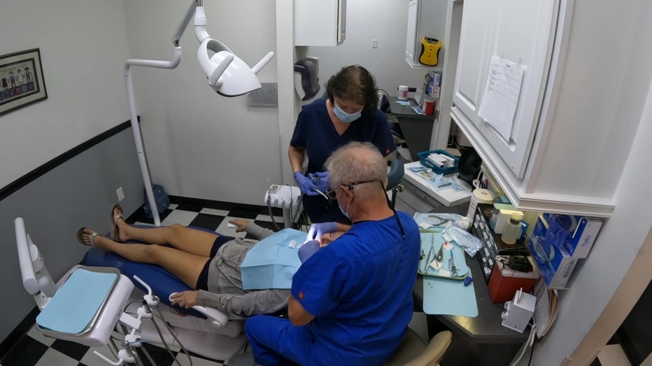 Dr. Richard Reddy does dental work on one of the patients receiving free care from Nature Coast Ministries No Cost Dental.