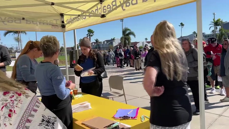 Tampa Bay Beaches Chamber of Commerce workers handing out gift cards to hospitality workers.