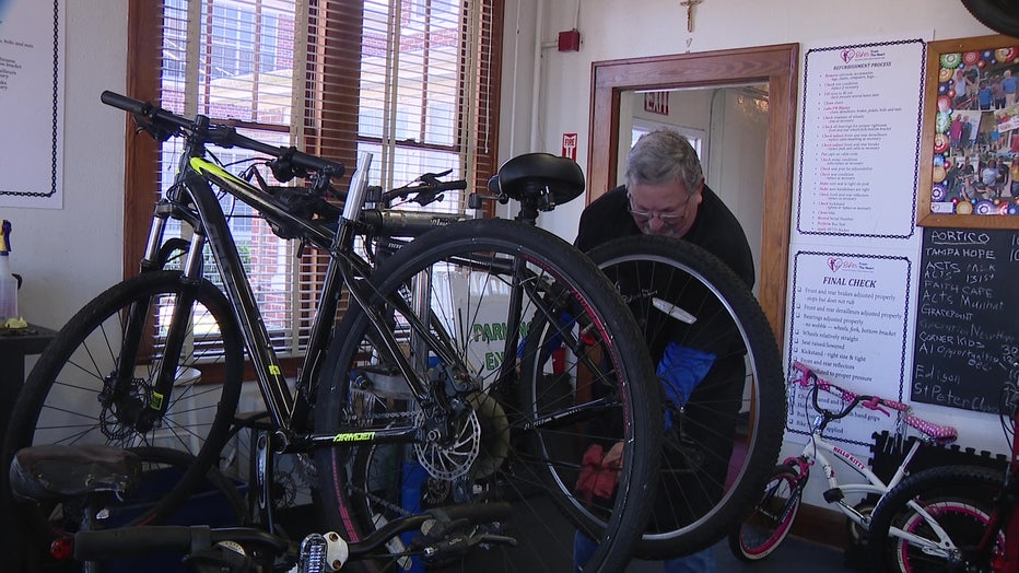 A Bike from the Heart volunteer refurbishing a bike.