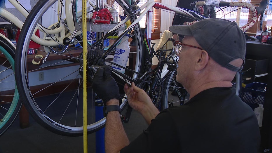 A Bike from the Heart volunteer refurbishing a bike.