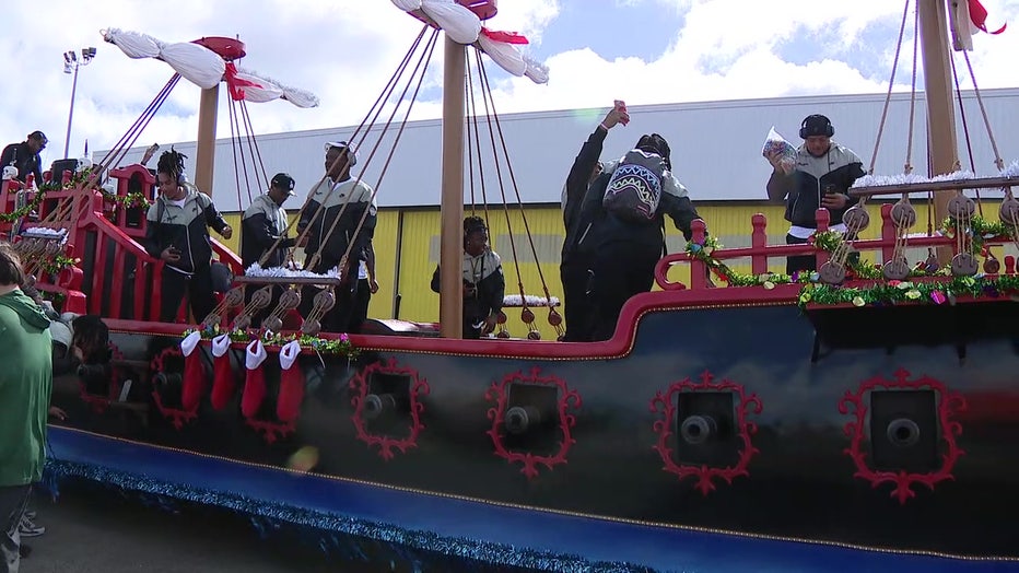 Tulane football players on 'Gasparilla' themed boat leaving Tampa International Airport.