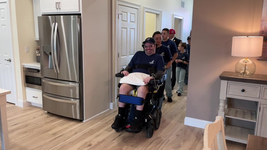 Jonathan Rodriguez is being shown his new home that was built by Tunnel to Towers.