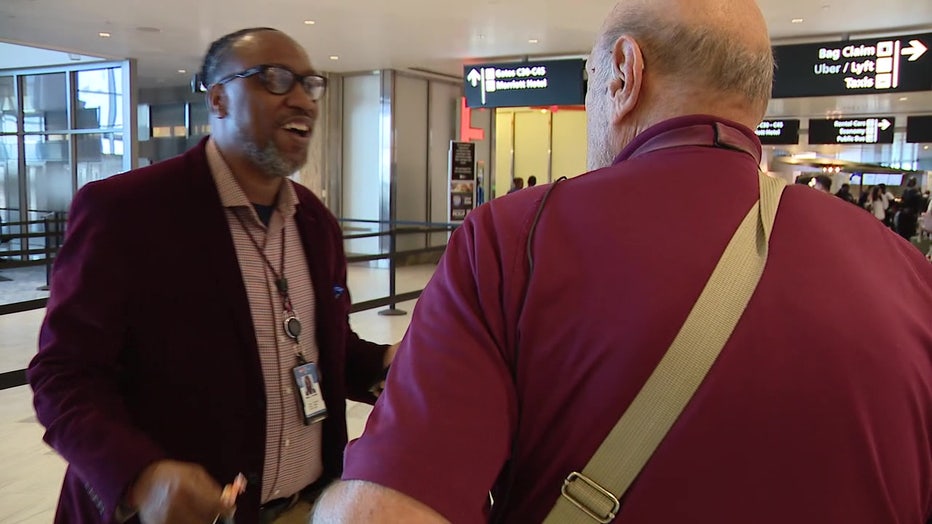 Krzanowski speaking with a passenger at TPA.