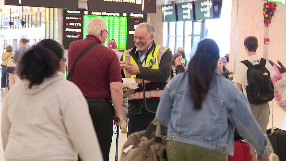 Krzanowski speaking with a passenger at TPA.