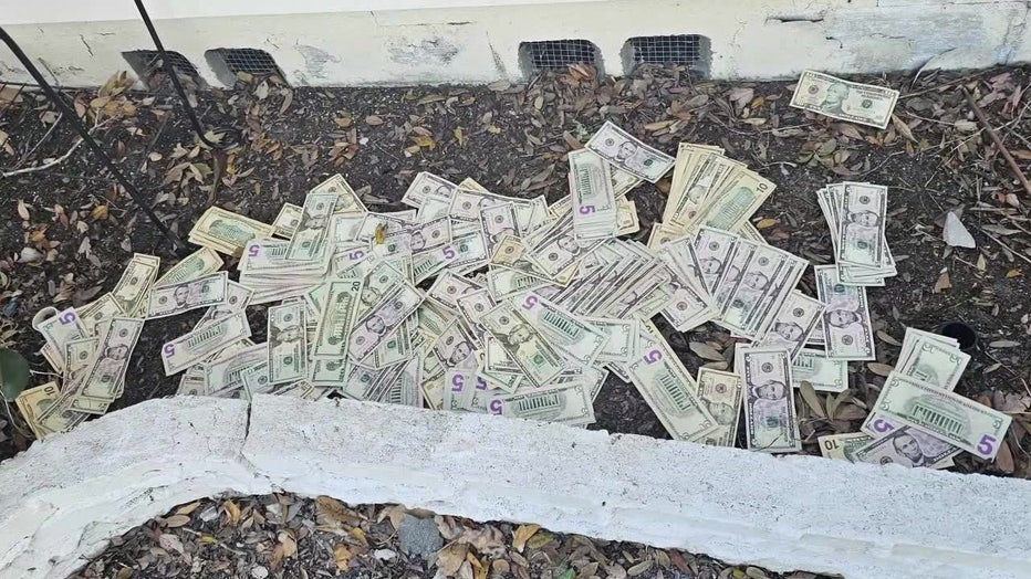 The cash outside the St. Petersburg man's home is waiting for families in need to pick it up before Christmas.