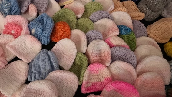 Lutz Senior Center volunteers making beanies for premature babies
