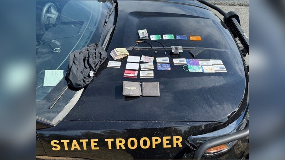 Troopers said they found 4 skimming devices and 20 fraudulent credit cards in the suspect's vehicle. Image is courtesy of FHP.