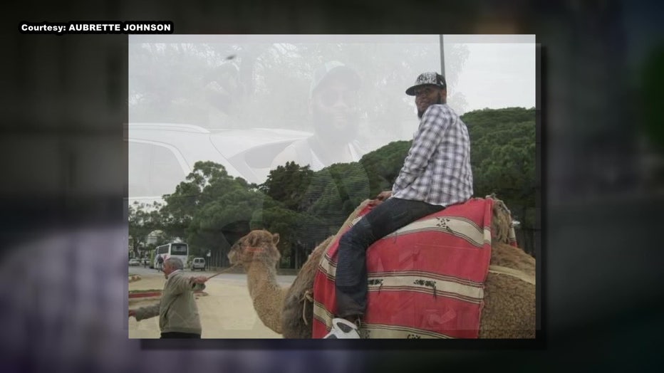 Timothy Freeman riding a camel.