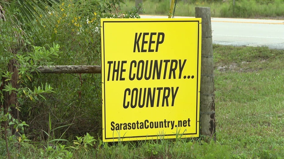 A sign that is protesting the redevelopment of cattle land at Lakewood Ranch Southeast in Sarasota County.