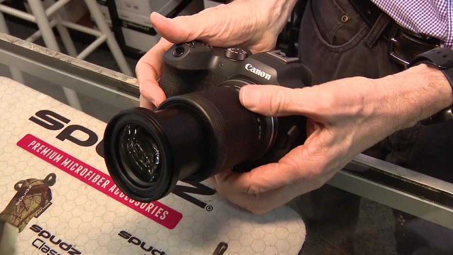 Smetzer is showing a cannon camera that he has for sale.