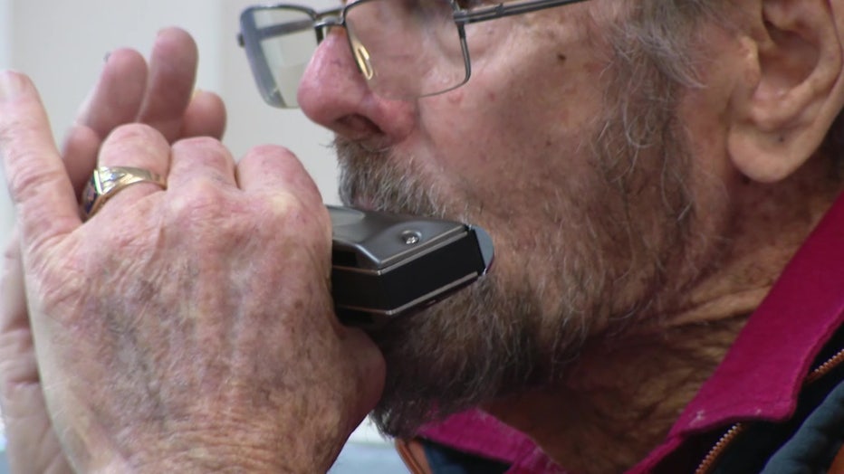 Bud Dickey playing the harmonica.