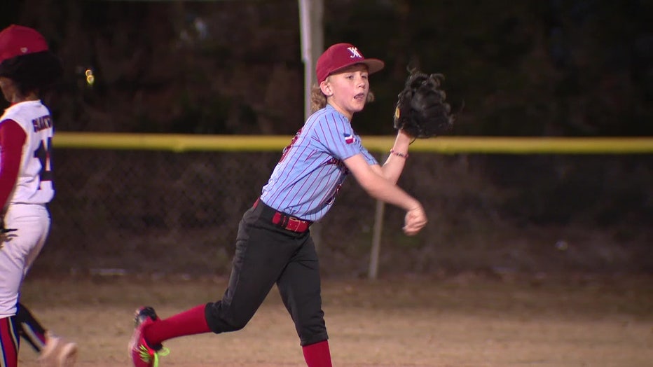 Charlie playing baseball.