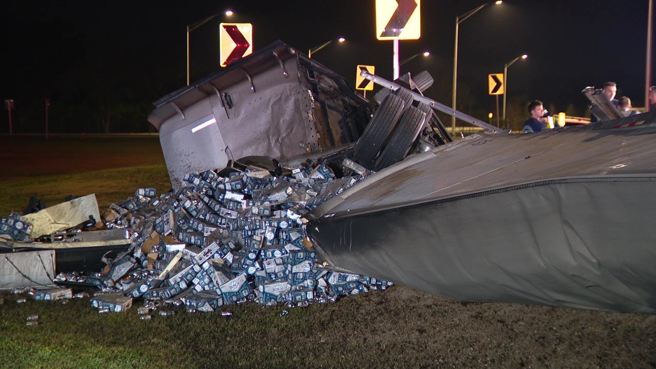 Semi-truck overturns, spills beer off I-75