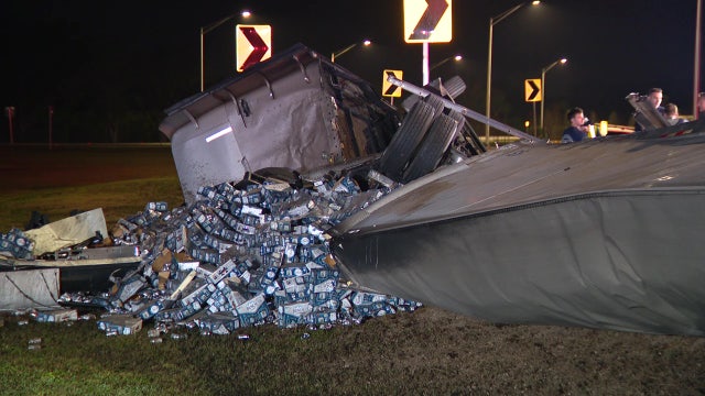 Semi-truck overturns, spills beer off I-75