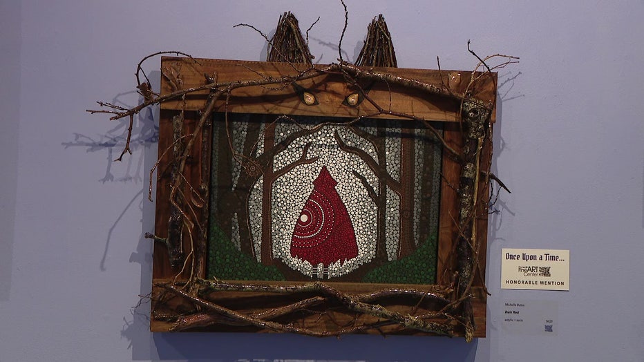 Artwork of many Little Red Riding Hood displayed at the Dunedin Fine Art Center's 