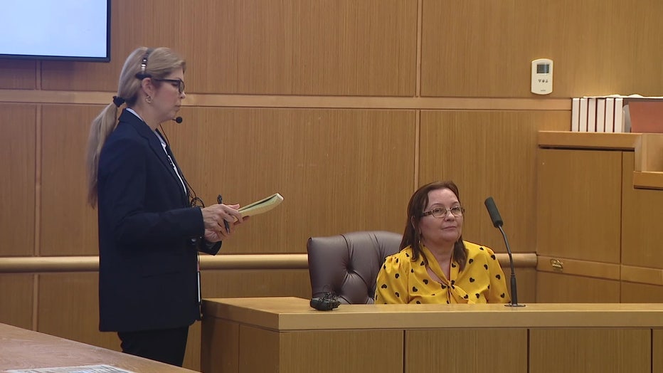 Pictured: Domingo Rodriguez's wife testifying on his behalf on Wednesday.