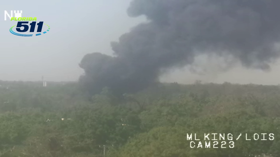 Junkyard fire burns near Tampa International Airport