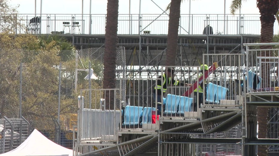 Crews tearing down the racetrack of the Firestone Grand Prix auto race in St. Petersburg on Monday.