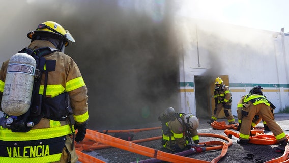 Firefighter hospitalized after fire at East Tampa commercial facility