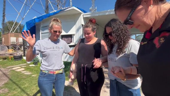 Volunteers help mother move into new home after hurricanes