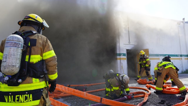 Firefighter hospitalized after fire at East Tampa commercial facility
