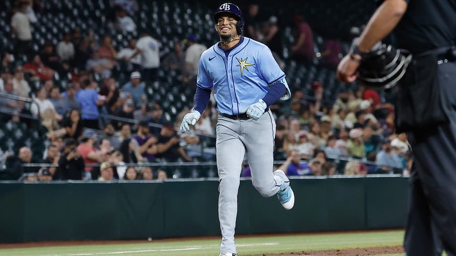 PHOENIX, AZ - APRIL 24: Tampa Bay Rays outfielder Christopher Morel (24) smiles as he runs the bases after hitting a home run during the MLB baseball game between the Tampa Rays and the Arizona Diamondbacks on April 24, 2025 at Chase Field in Phoenix, Arizona. (Photo by Kevin Abele/Icon Sportswire via Getty Images)
